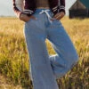Wide Leg Tie Waist Jeans in Light Wash Denim 2 Wide Leg Tie Waist Jeans in Light Wash Denim -ROOLEE FASHION SHOP 028A3712